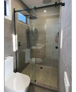 Customised Wall To Wall Frameless Sliding Shower Screen With Matte Black Fittings